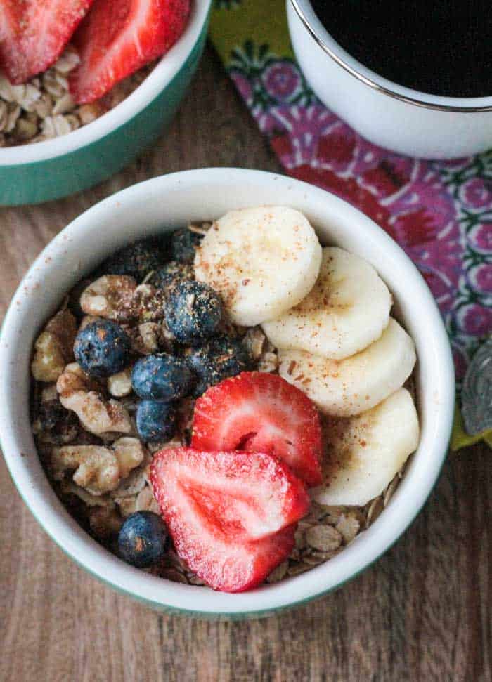 Breakfast Bowl with raw oats, strawberries, blueberries, bananas, walnuts, and flaxmeal. 