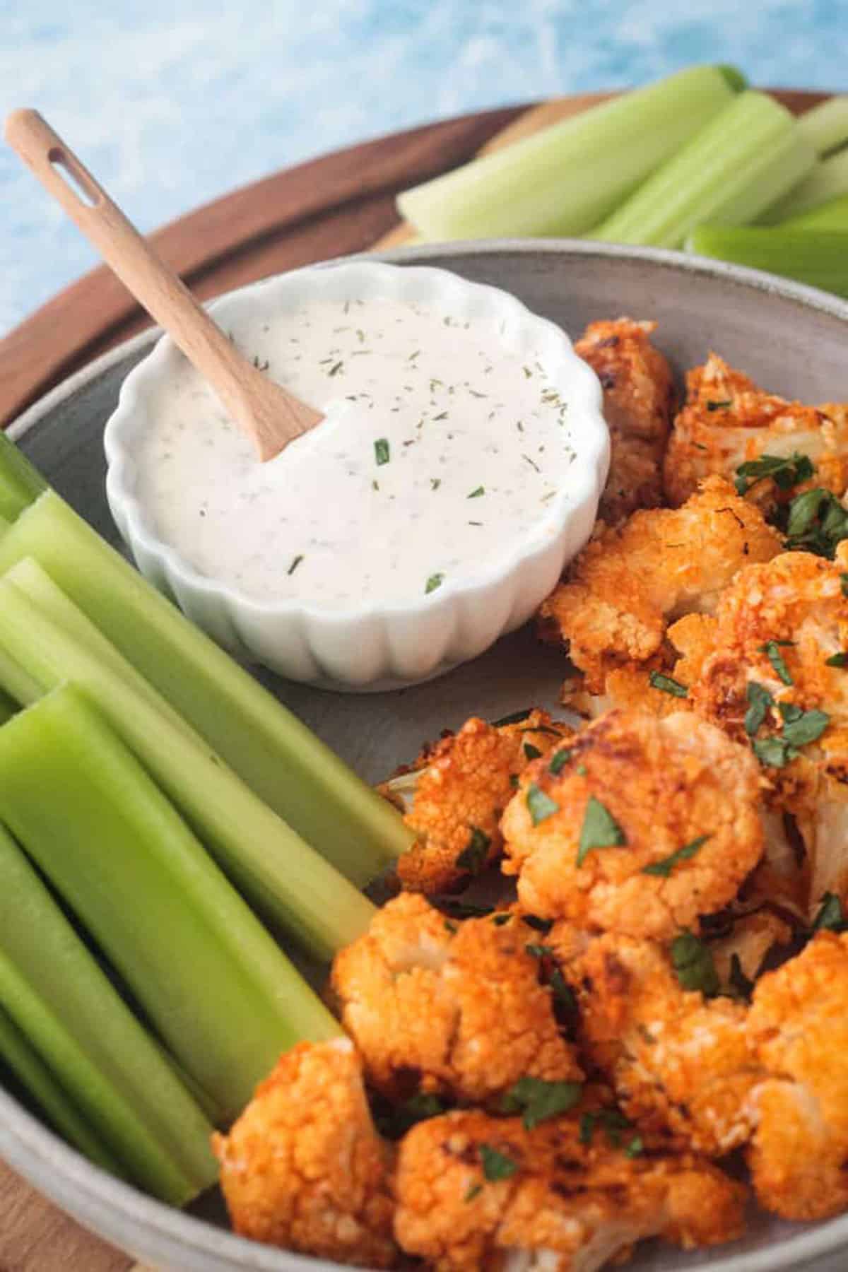 Buffalo cauliflower on a plate with ranch.