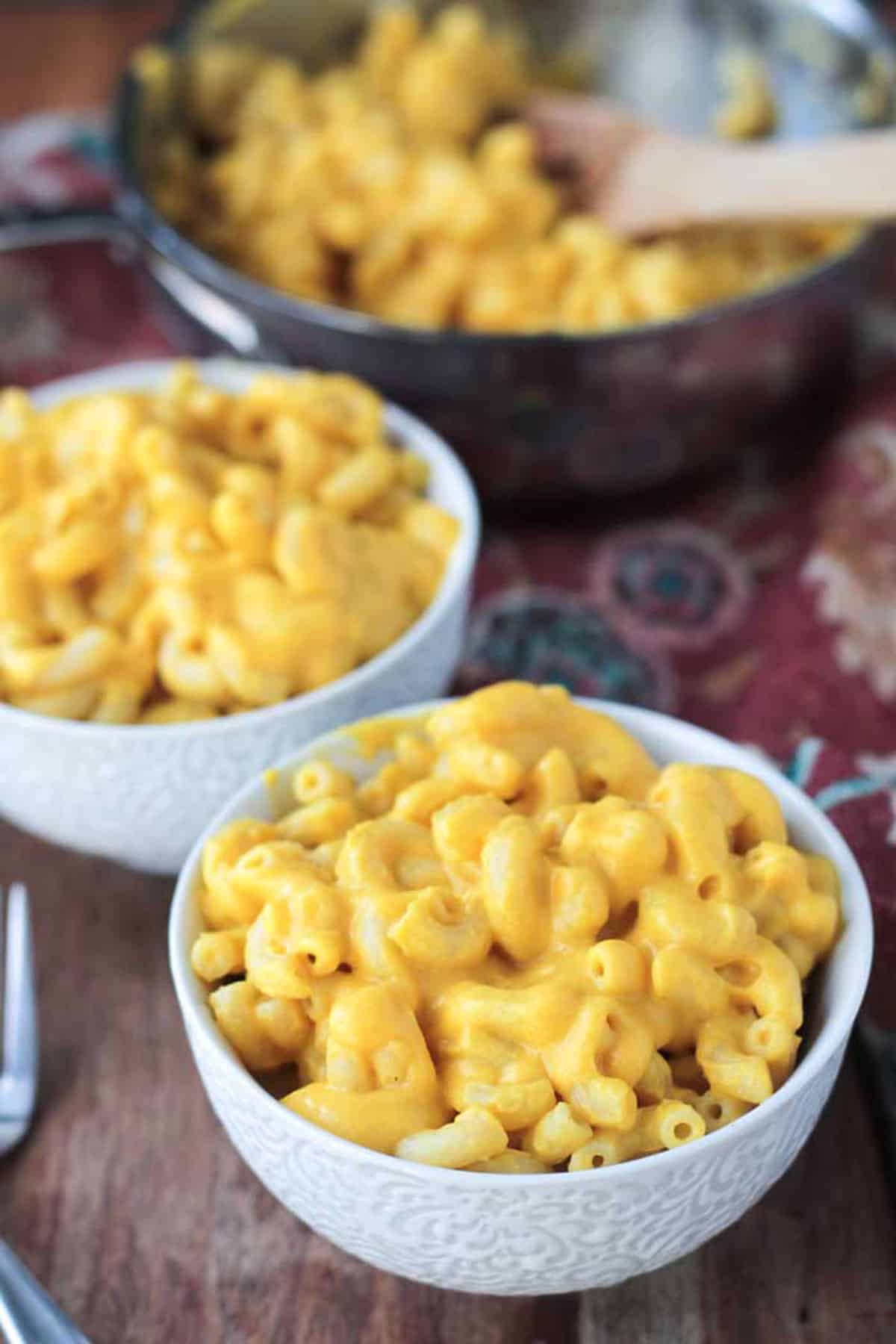 Two bowls of creamy pasta.