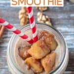 Diced cinnamon apple topping on a creamy apple smoothie.