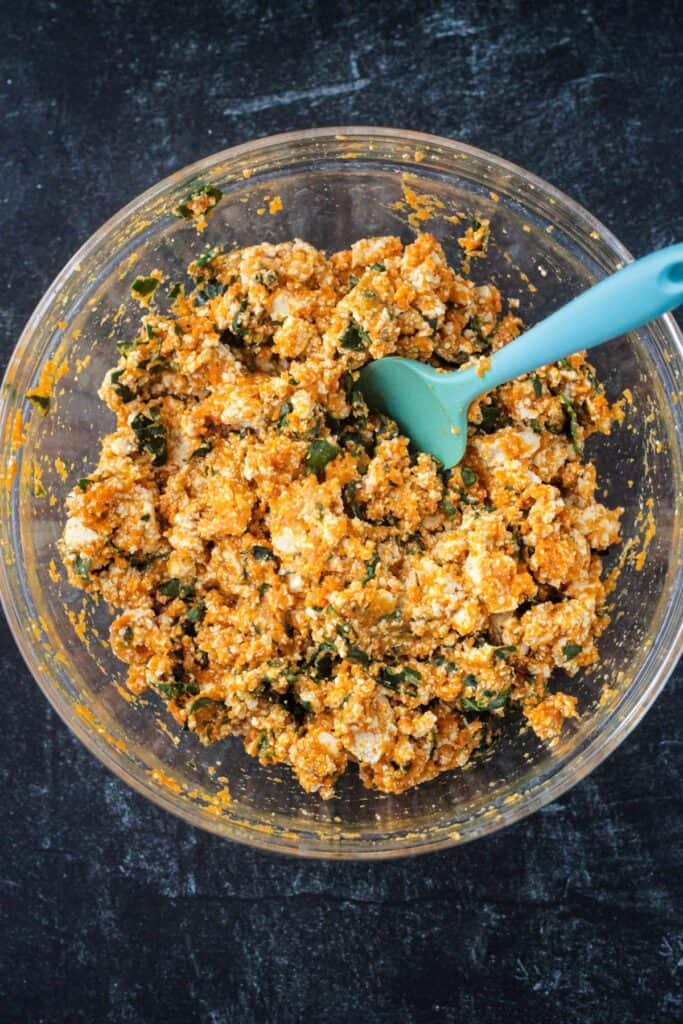 Pumpkin, kale, tofu, onions and spices all mixed together.