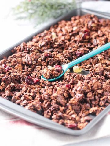 Baking tray full of gingerbread gluten free granola.