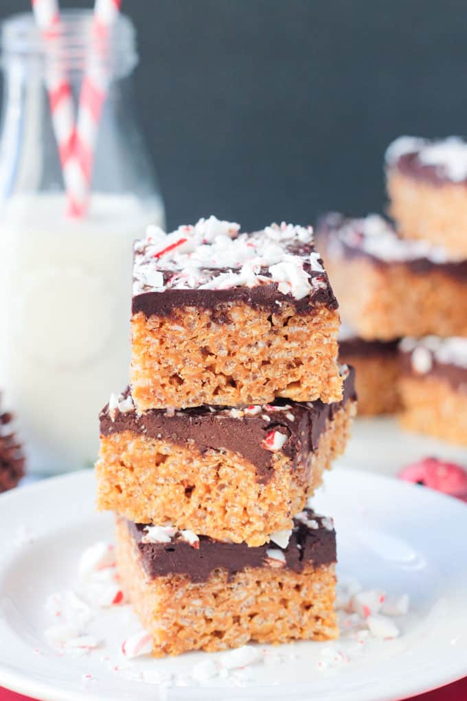 Chocolate Peppermint Rice Crispy Bars stacked three high on a plate.
