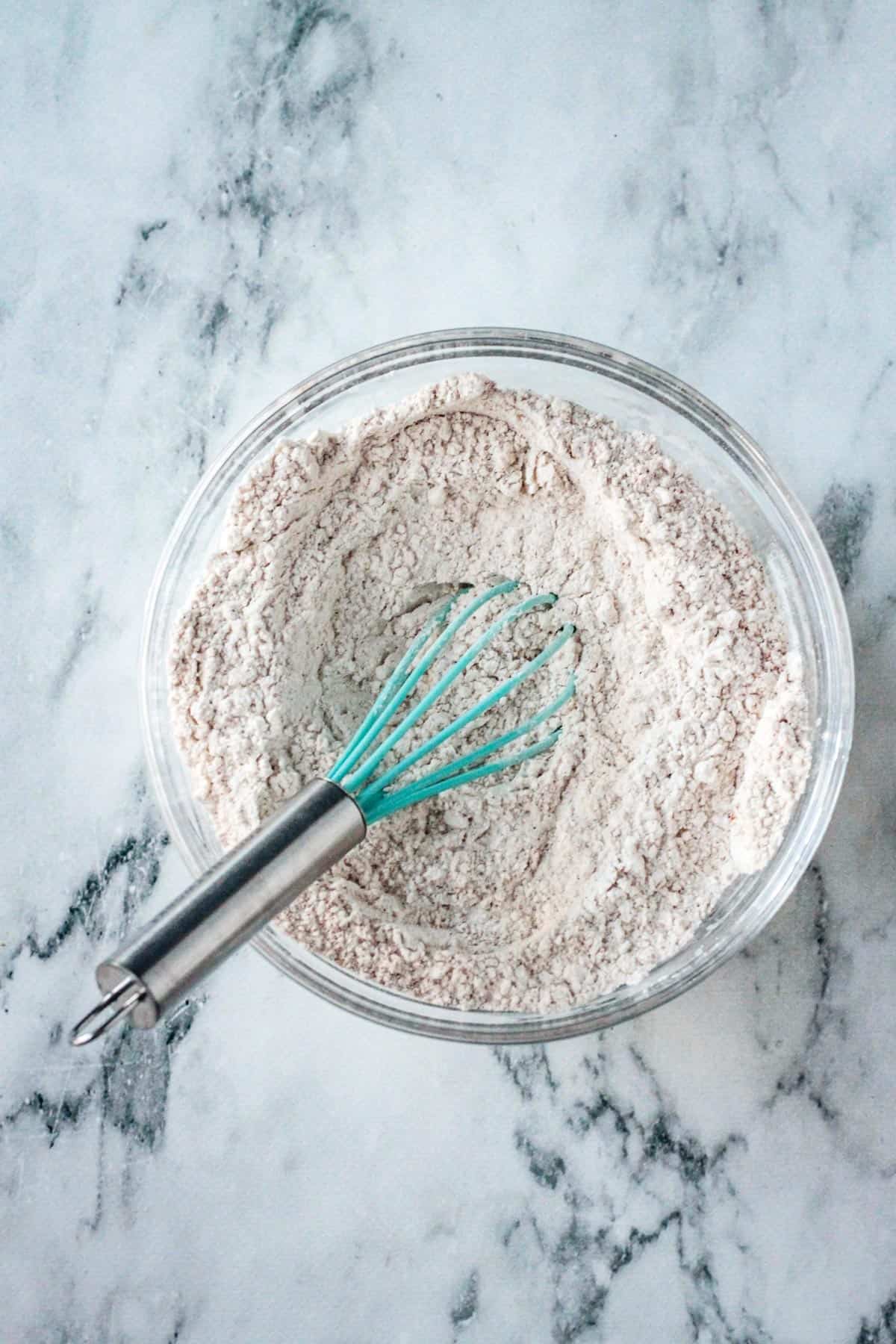 Dry ingredients whisked together in a bowl.