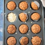 Baked carrot muffins in a muffin tin.