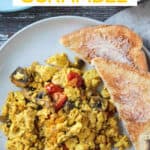 Plated tofu scramble with a side of buttered toast.