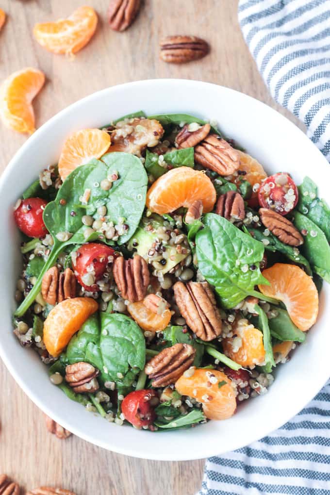 Lentil Quinoa Salad w/ Spinach and Citrus. Garnished with pecans. 