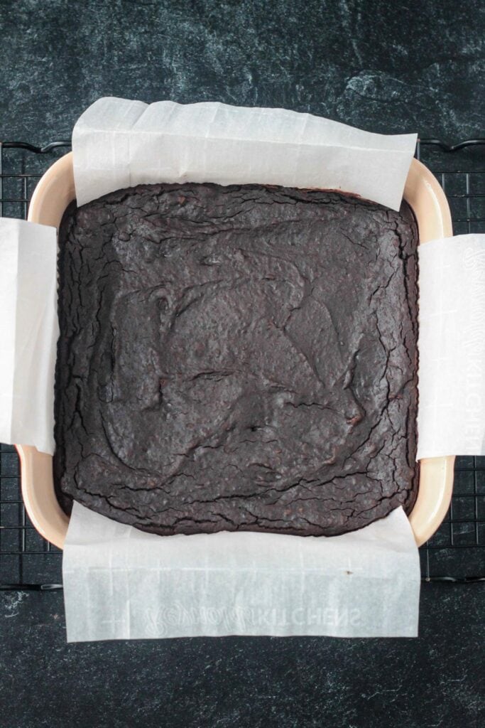 Baked vegan black bean brownies in a sqaure pan.
