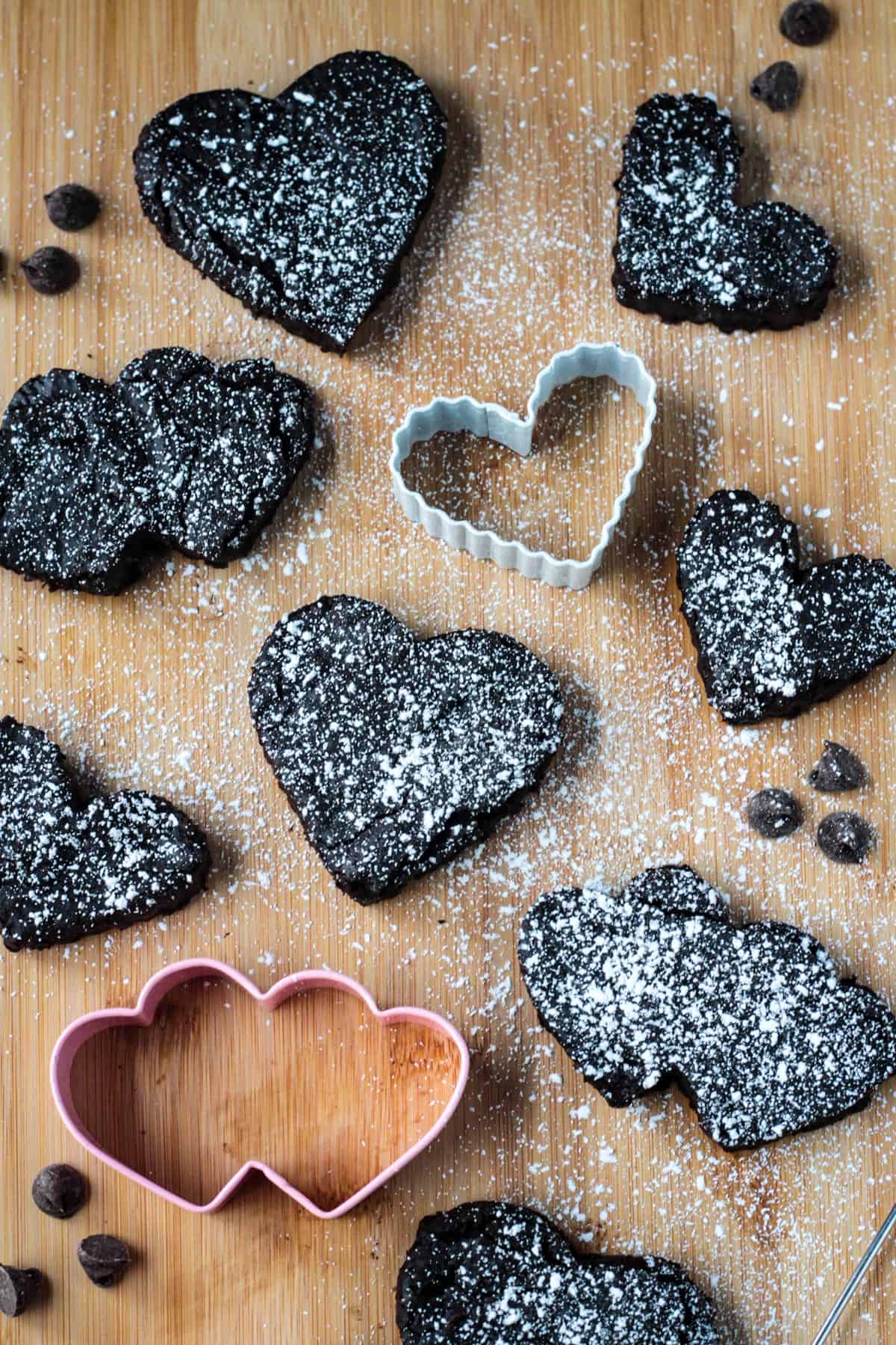 Sugared brownies cut into various heart shapes.