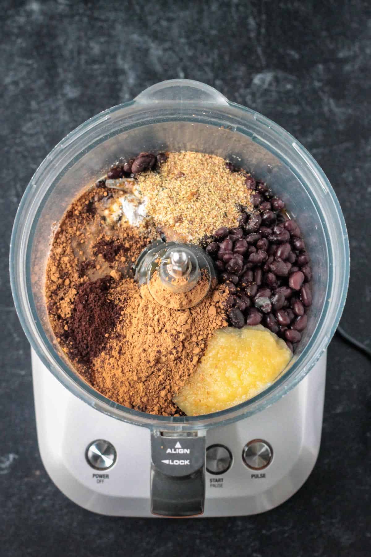 Ingredients in the bowl of a food processor.