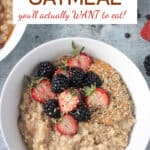 Bowl of creamy oatmeal topped with fresh berries.