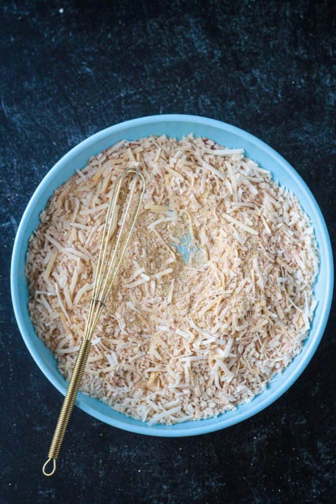 Dry breading ingredients whisked in a bowl.