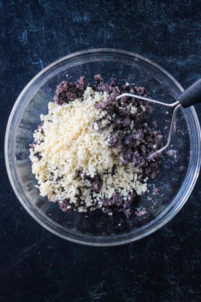 Millet and black beans in a mixing bowl.