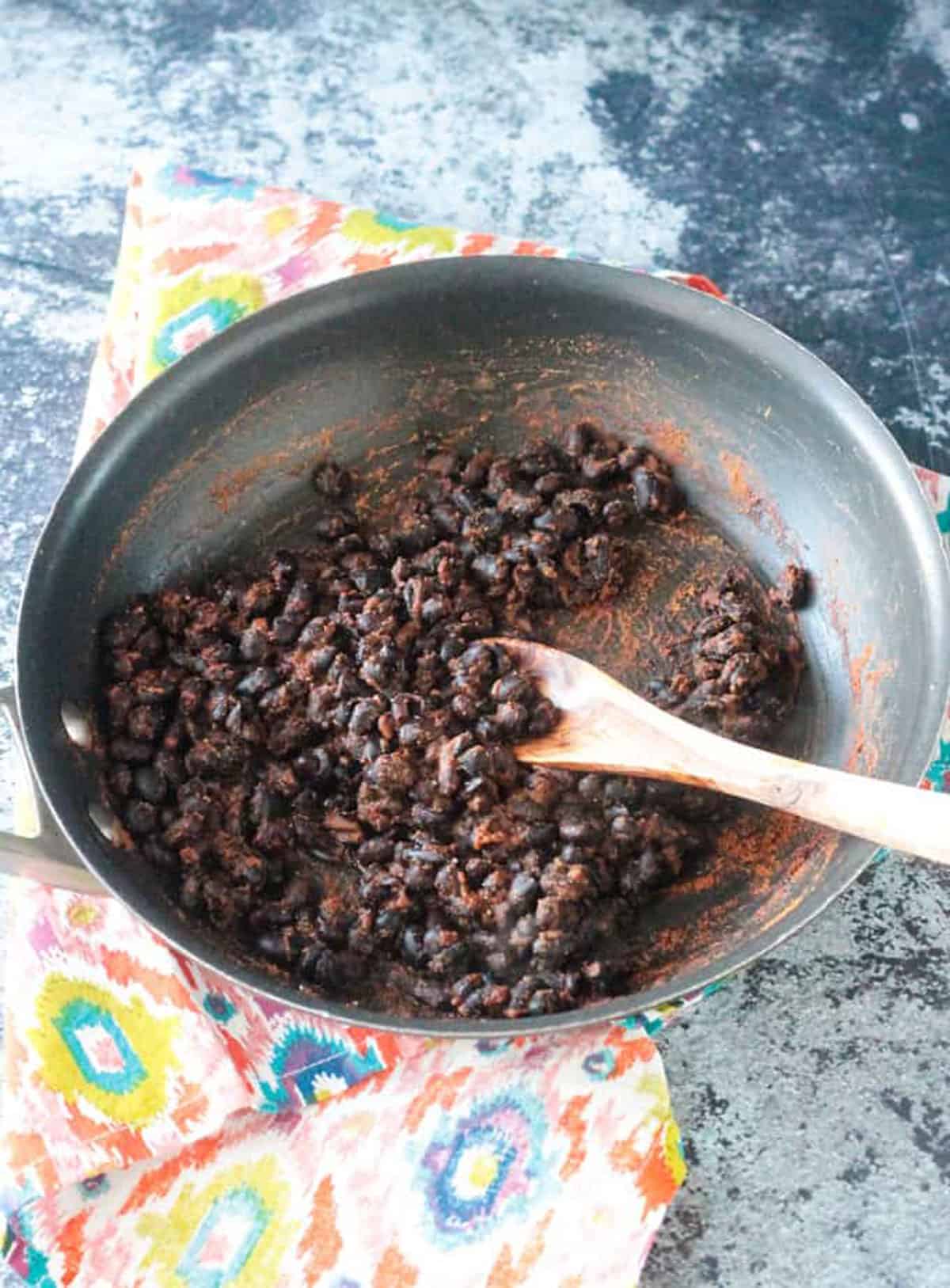 Skillet of spiced black beans.