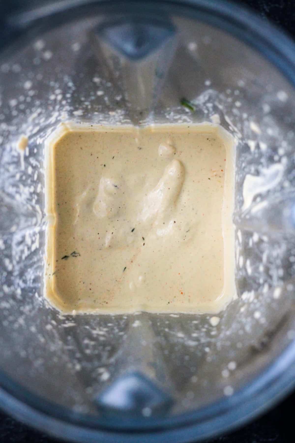 Creamy ranch dressing in a blender.
