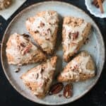 Five triangular scones on a plate.