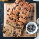 Sliced loaf of vegan peanut butter banana bread on a serving board.