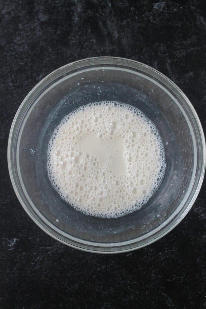 Non-dairy milk and vinegar whisked together until frothy.