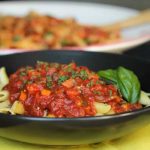 chunky tomato sauce over penne pasta