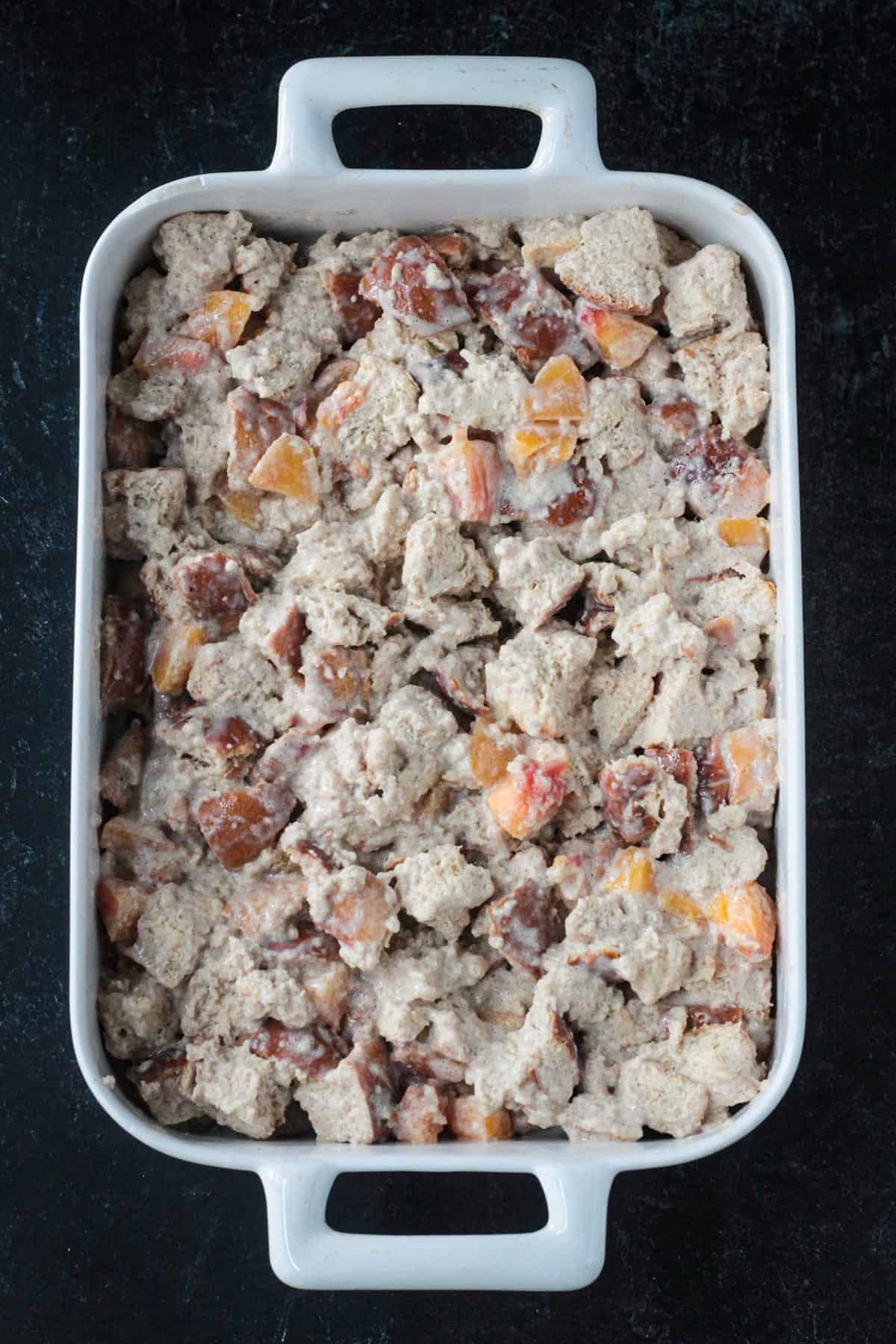 Unbaked casserole in a baking dish.