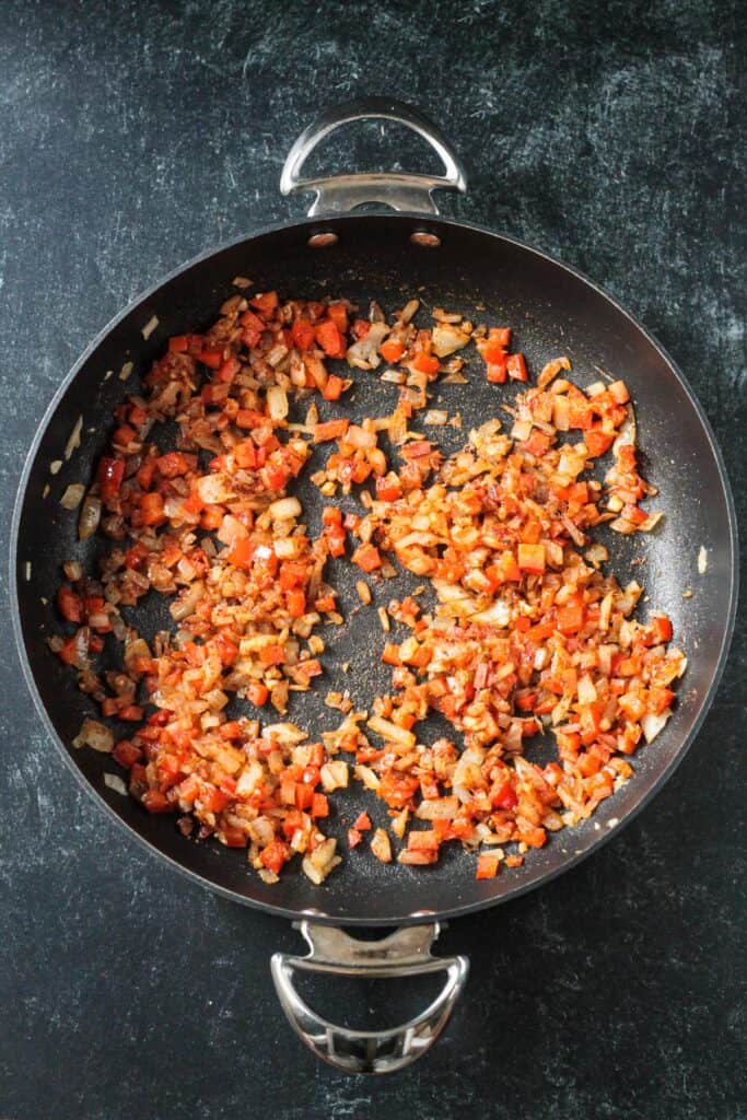 Sautéed veggies mixed with the spices.