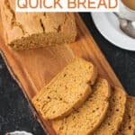 Loaf of butternut squash bread sliced on a serving board.