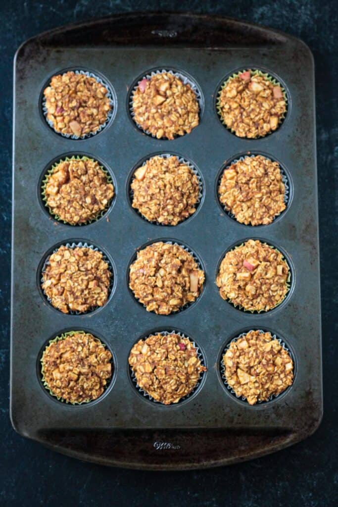 Baked oatmeal muffins in a pan.