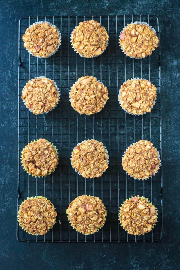 Baked oatmeal muffins on a cooling rack.