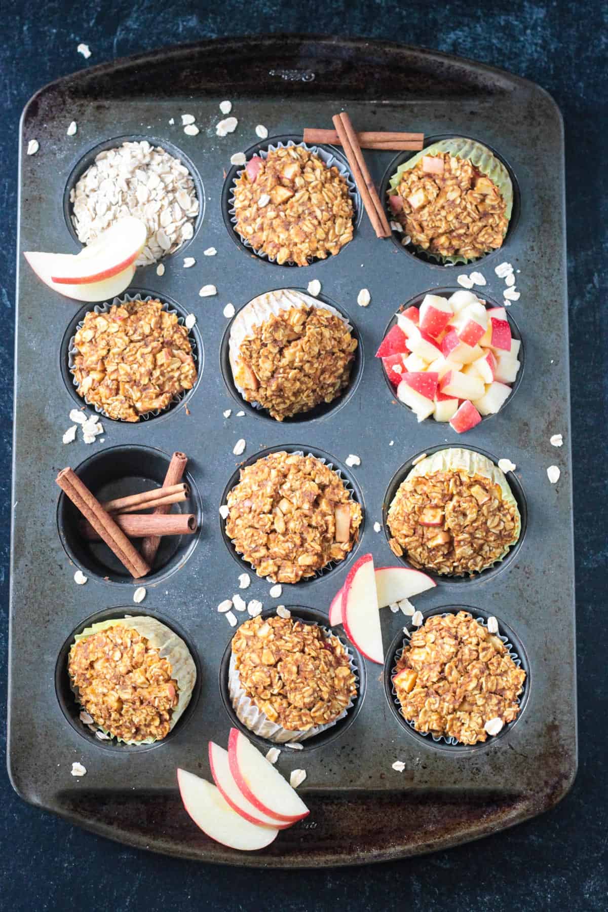 Baked oatmeal cups arranged in a muffin tin.