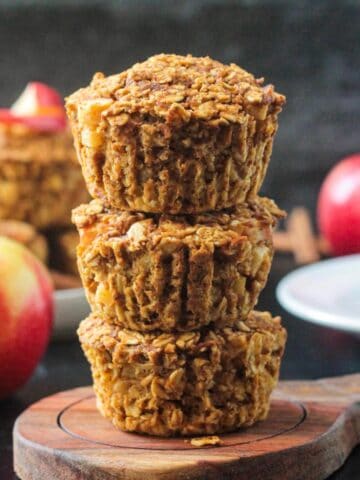 Three baked oat cups in a stack.