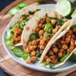 Chickpeas spilling out of a tortilla.