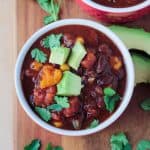 Bowl of crock pot vegan chili with black beans and butternut squash.