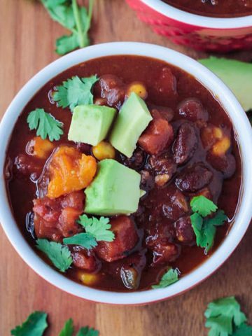 Bowl of crock pot vegan chili with black beans and butternut squash.