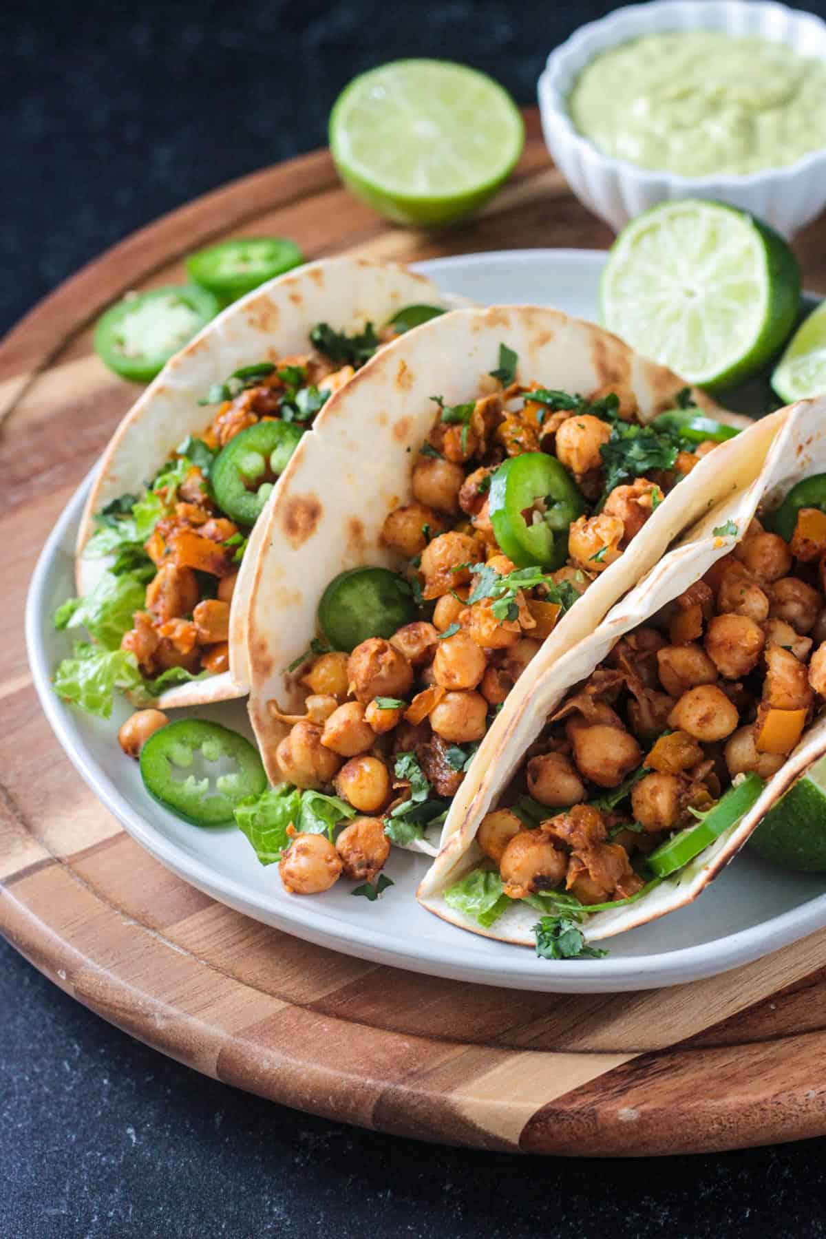 Chickpeas spilling out of a tortilla.