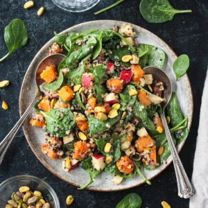 Butternut squash quinoa salad with spinach and chopped apples.