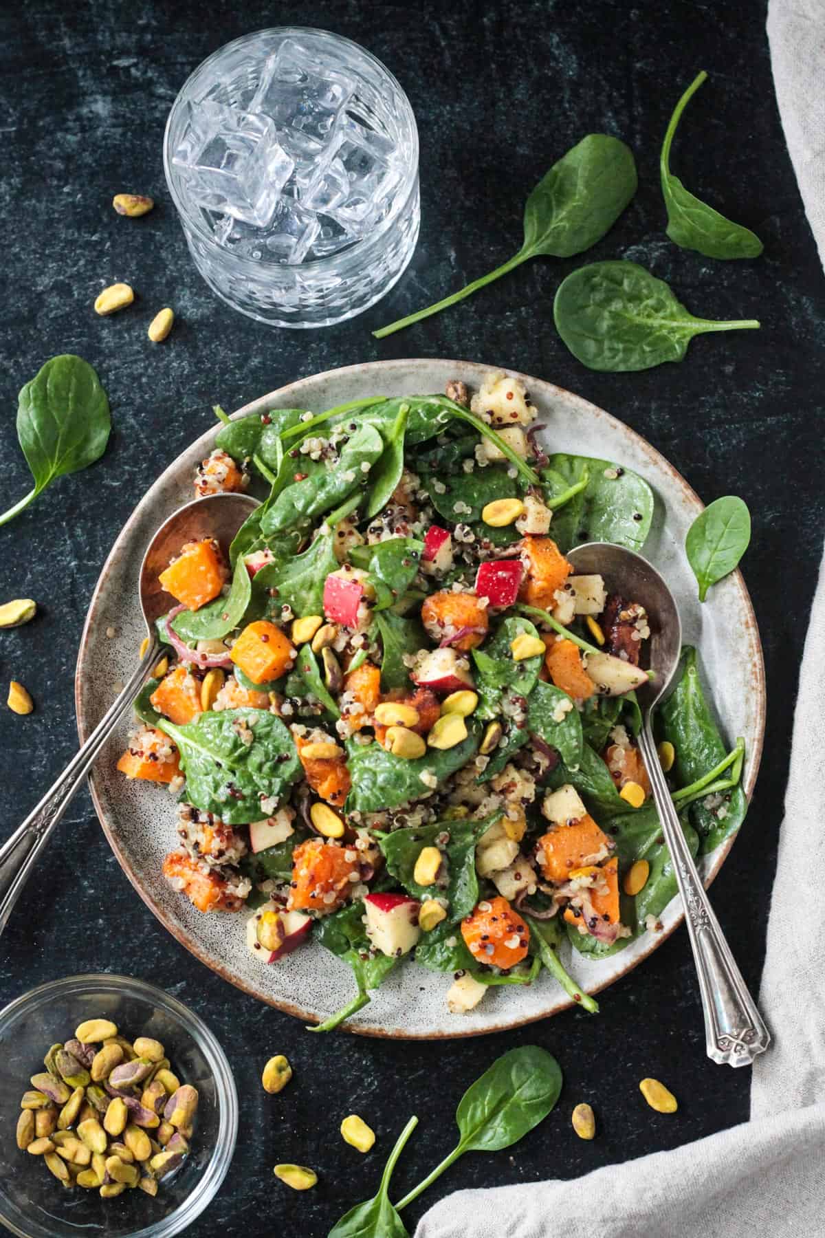 Butternut squash quinoa salad with spinach and chopped apples.
