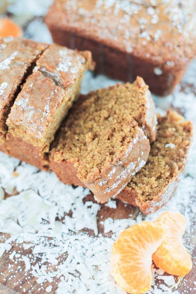 Close up view of a slice of Coconut Clementine Mini Loaf Cake.