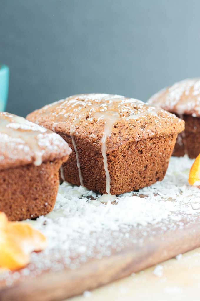 Coconut Clementine Mini Loaf Cakes dusted in powdered sugar.