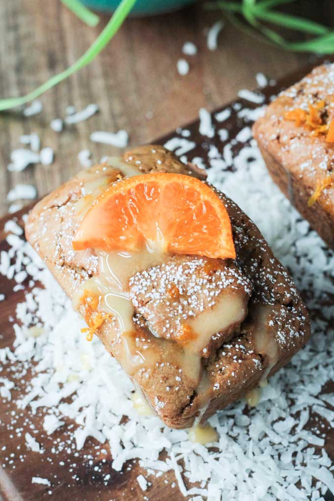 Close up overhead view of an individual Coconut Clementine Mini Loaf Cake.