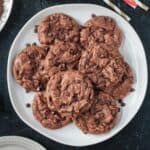 Stack of five almond flour chocolate cookies on a plate.