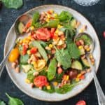 Black Eyed Peas Salad plated with two spoons.