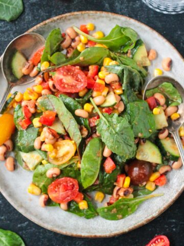 Black Eyed Peas Salad plated with two spoons.