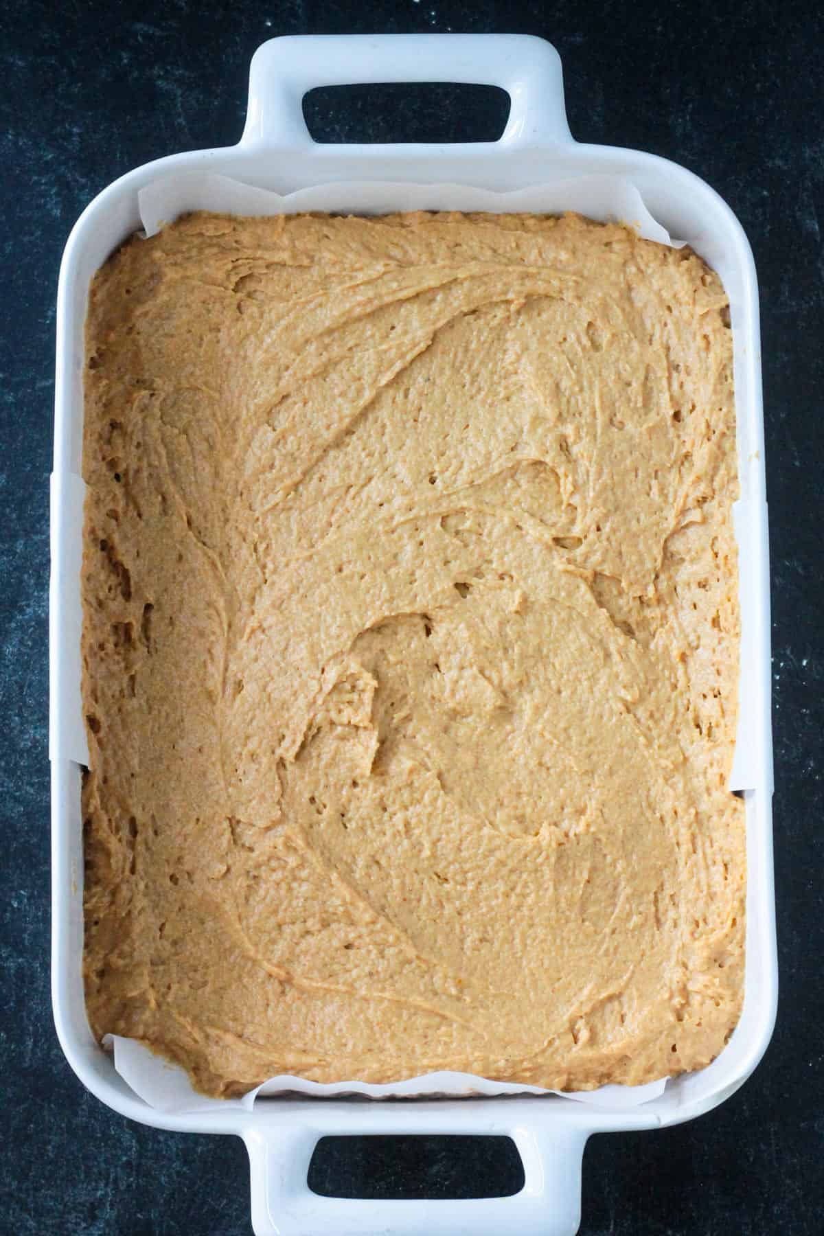 Batter spread in a baking dish.