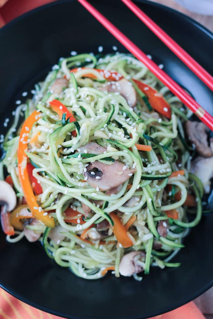 Close up overhead view of Stir Fry Zucchini Noodles w/ mushrooms and peppers. 