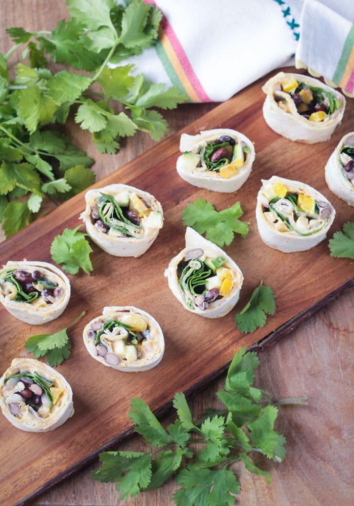 Party appetizers on a wooden serving platter