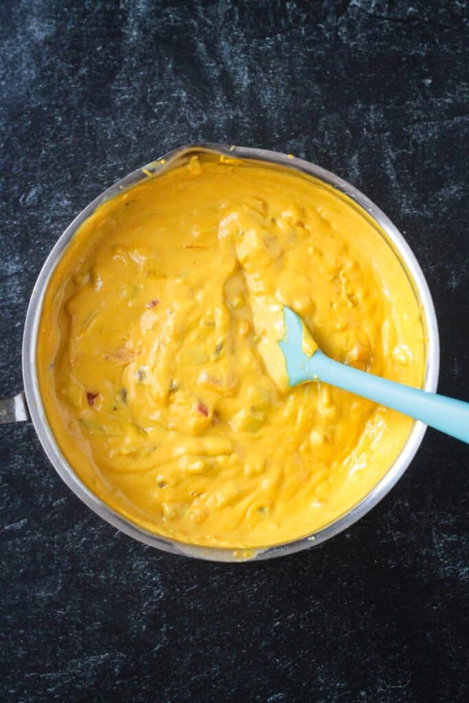 Butternut squash cashew queso with green chiles and salsa mixed in.