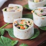 Southwest Roll Ups - the perfect party appetizer for your vegetarian and vegan friends. Full of flavor and protein, these little bites will please meat eaters too!
