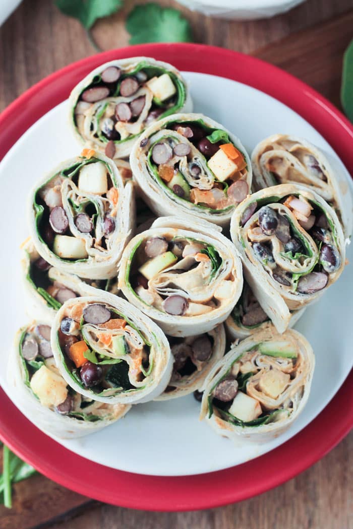 Overhead view of a pile of southwest roll ups on a plate
