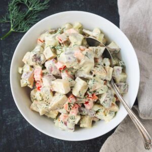 Vegan red roasted potato salad in a serving bowl.