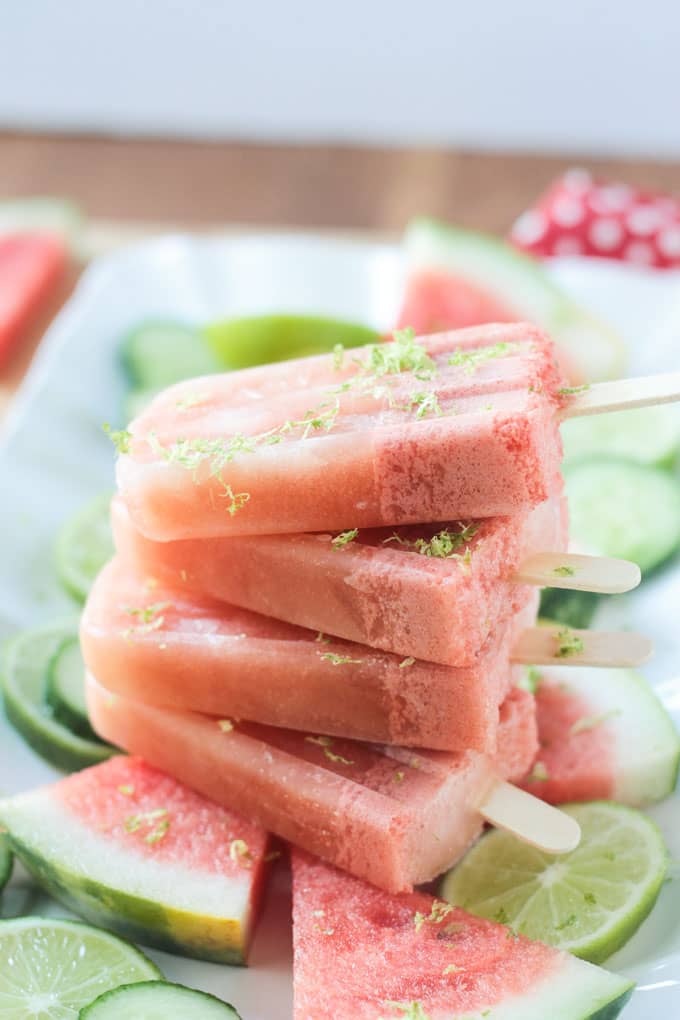 Stack of four watermelon popsicles.